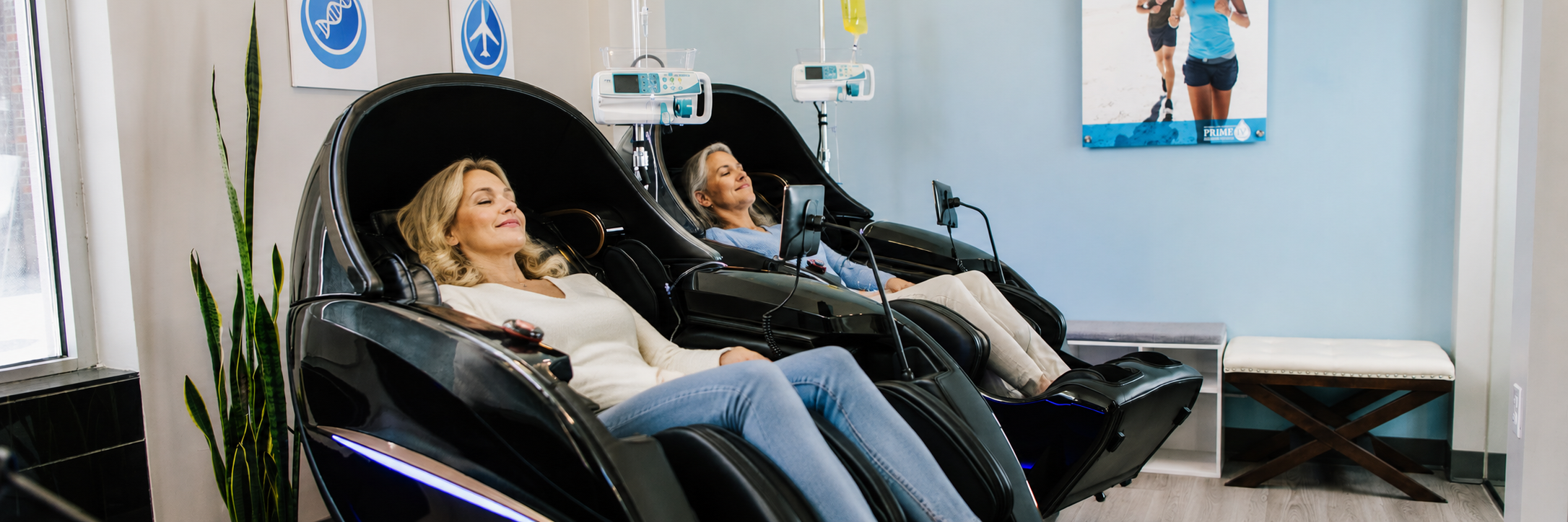 Clients relaxing during IV therapy in zero-gravity chairs